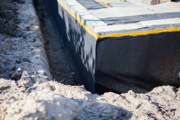 Professional Exterior Waterproofing technician working in Bedford, KY